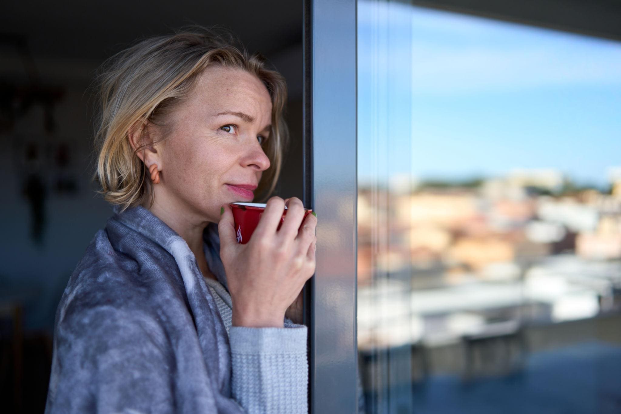 Woman redefining prosperity, safety, and success during midlife transition